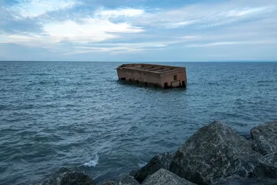 An old concrete structure floats near the shore of Lake Superior in Duluth, Minnesota.