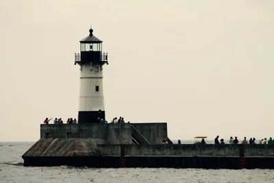 Duluth Harbor Lighthouse with visitors on the pier, USA